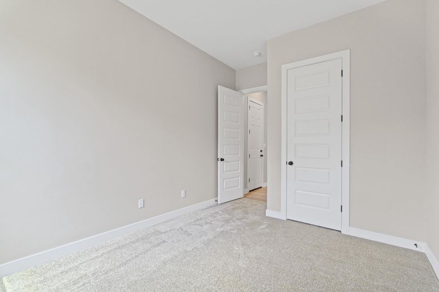 Neutral-toned walls complement light-colored carpeting Neutral-toned walls complement light-colored carpeting