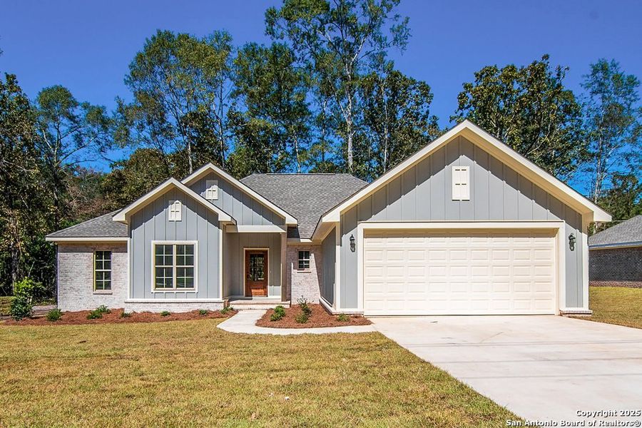 Front exterior of a new home in , La Vernia, TX, highlighting curb appeal (Image 1). Front exterior of a new home in , La Vernia, TX, highlighting curb appeal (Image 1).