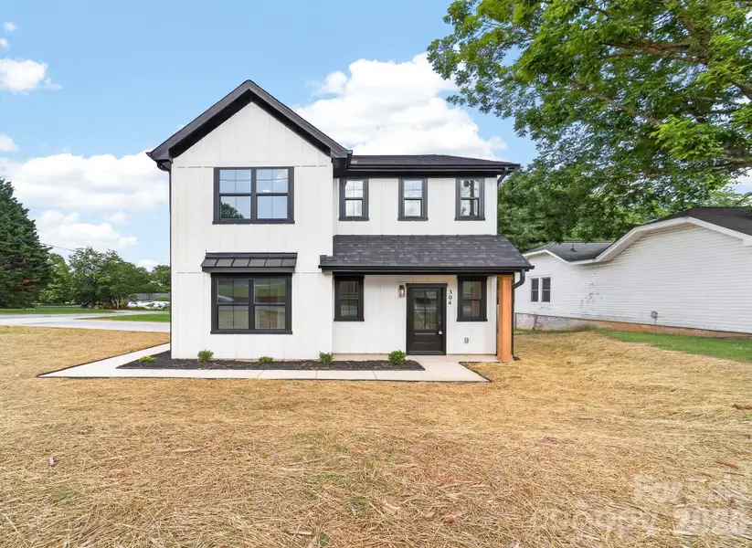 Front exterior of a new home in , Bessemer City, NC, highlighting curb appeal (Image 1). Front exterior of a new home in , Bessemer City, NC, highlighting curb appeal (Image 1).