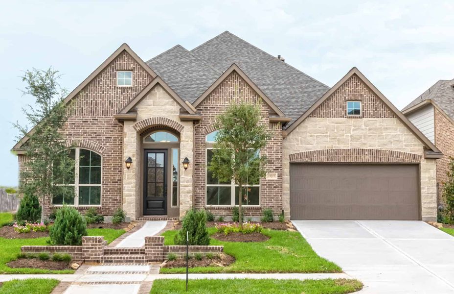 Representative exterior photo of a completed home built from the 3030 by Ravenna Homes in The Woodlands Hills 65′, Willis, TX (Image 21). Representative exterior photo of a completed home built from the 3030 by Ravenna Homes in The Woodlands Hills 65′, Willis, TX (Image 21).