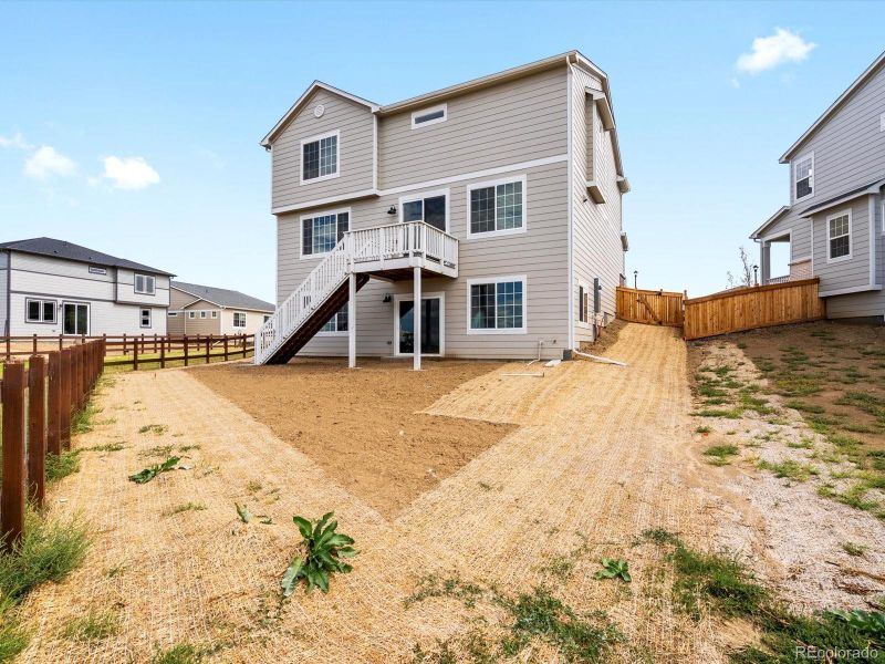Exterior details and patio area of a home in Buffalo Highlands: The Canyon Collection, Commerce City (Image 3).