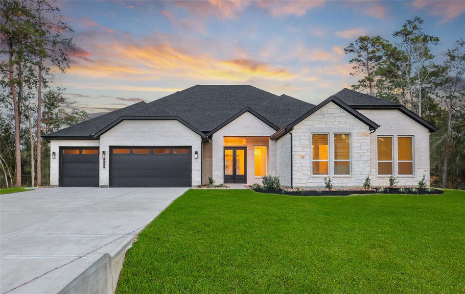 Front exterior of a new home in Butlers Bend Estates, Pinehurst, TX, highlighting curb appeal (Image 1).