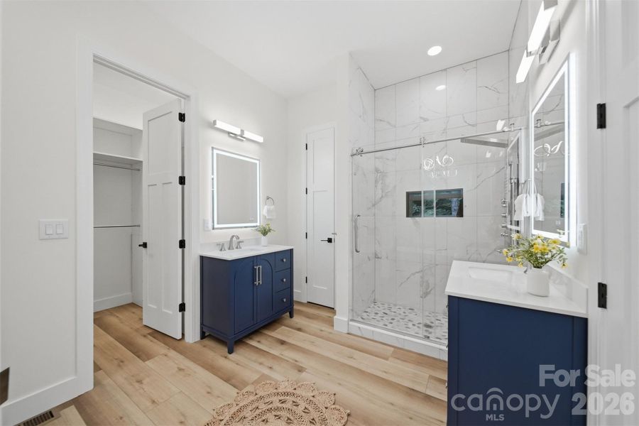 His/ her sinks in the master bedroom, light up mirror, tile shower