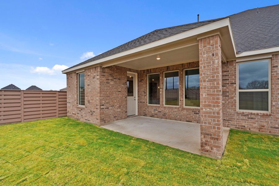 This oversized backyard and covered patio beacon you to dream big.