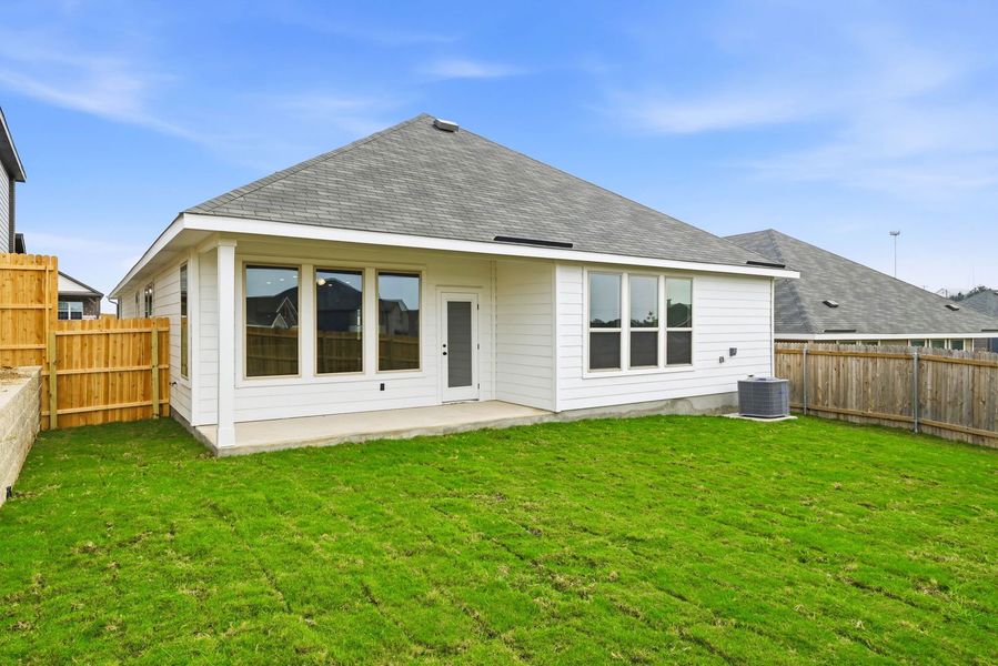 Exterior details and patio area of a home in Seven Oaks Townhomes, Tomball (Image 4). Exterior details and patio area of a home in Seven Oaks Townhomes, Tomball (Image 4).