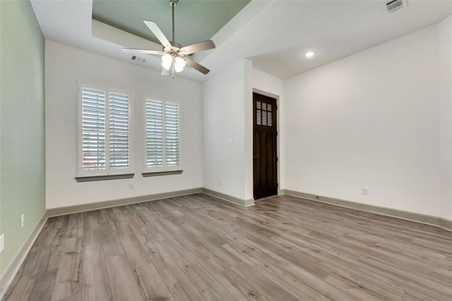 Spare room featuring light hardwood / wood-style floors and ceiling fan