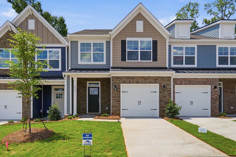 Front exterior of a new home in Harrisburg Village Townhomes, Harrisburg, NC, highlighting curb appeal (Image 1). Front exterior of a new home in Harrisburg Village Townhomes, Harrisburg, NC, highlighting curb appeal (Image 1).