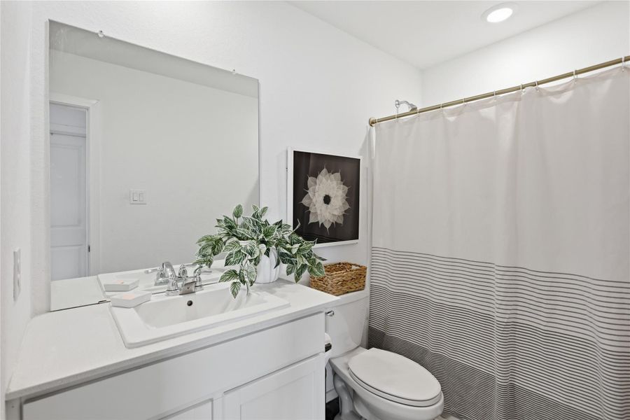 Upstairs bathroom with tub and shower.