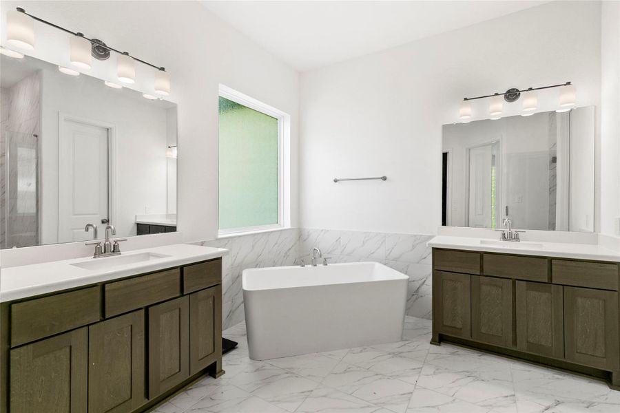 Primary bath with inviting freestanding soaking tub