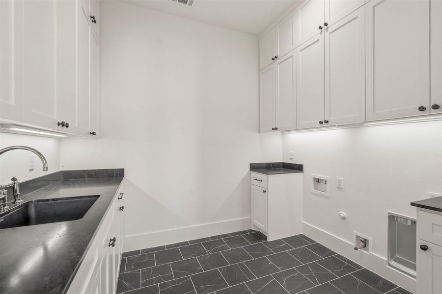 On the other side of the first floor in the south wing, your first floor utility room with a sink and ample storage. On the other side of the first floor in the south wing, your first floor utility room with a sink and ample storage.