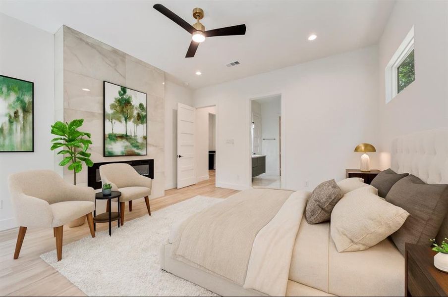 Bedroom with light wood-style flooring, recessed lighting, connected bathroom, and a ceiling fan