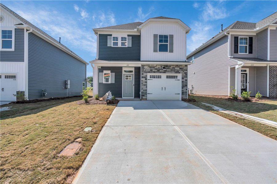 Front exterior of a new home in Brownstone Park, Easley, SC, highlighting curb appeal (Image 2).