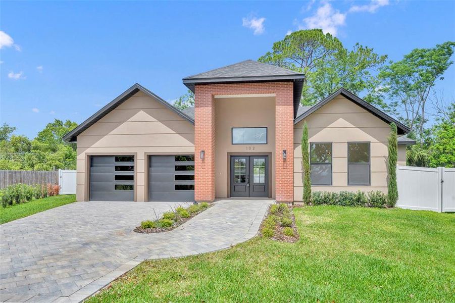 Front exterior of a new home in , Winter Park, FL, highlighting curb appeal (Image 1). Front exterior of a new home in , Winter Park, FL, highlighting curb appeal (Image 1).