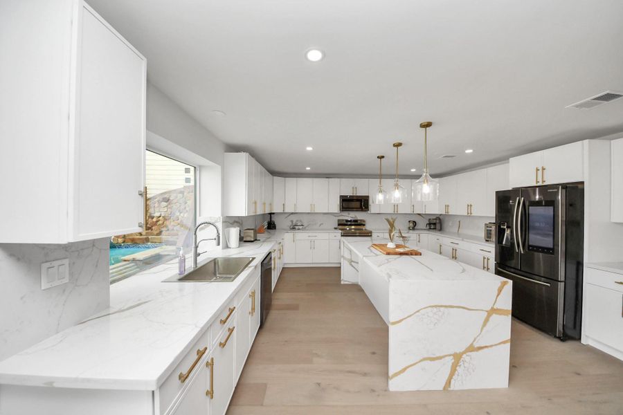 Tons of cabinet and counter space in this elegant kitchen. Notice the oversized farmhouse sink! Tons of cabinet and counter space in this elegant kitchen. Notice the oversized farmhouse sink!