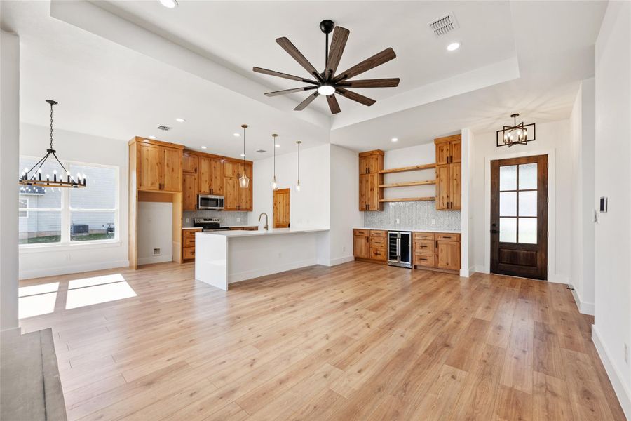 Kitchen featuring a chandelier, plenty of natural light, hanging light fixtures, and recessed lighting