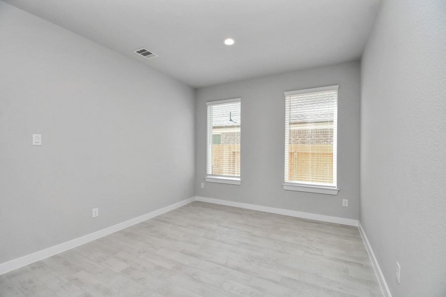 Create lasting memories with your family and friends at the dining table! This expansive dining room showcases sophisticated flooring, custom paint, and seamlessly connects to the family room and kitchen, providing an open and inviting atmosphere. Sample photo of completed home with similar floor plan. Actual colors and selections may vary. Create lasting memories with your family and friends at the dining table! This expansive dining room showcases sophisticated flooring, custom paint, and seamlessly connects to the family room and kitchen, providing an open and inviting atmosphere. Sample photo of completed home with similar floor plan. Actual colors and selections may vary.