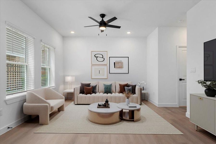 Staged- bright, airy living space with open-concept design Staged- bright, airy living space with open-concept design