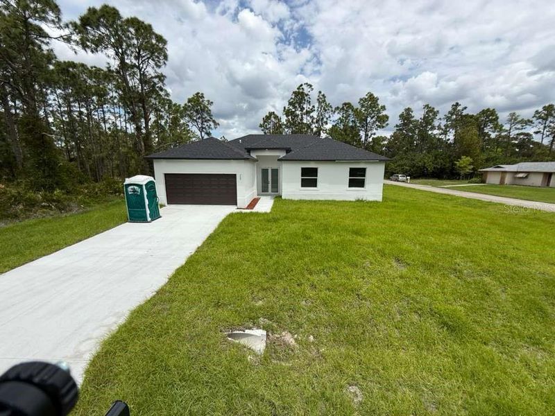 Exterior details and patio area of a home in , Lehigh Acres (Image 23). Exterior details and patio area of a home in , Lehigh Acres (Image 23).