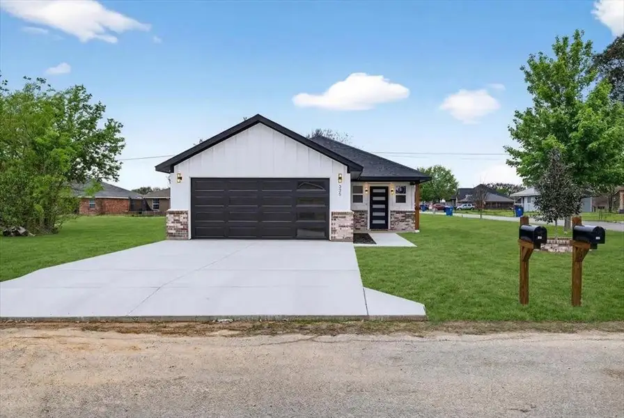 Front exterior of a new home in , Gun Barrel City, TX, highlighting curb appeal (Image 1). Front exterior of a new home in , Gun Barrel City, TX, highlighting curb appeal (Image 1).
