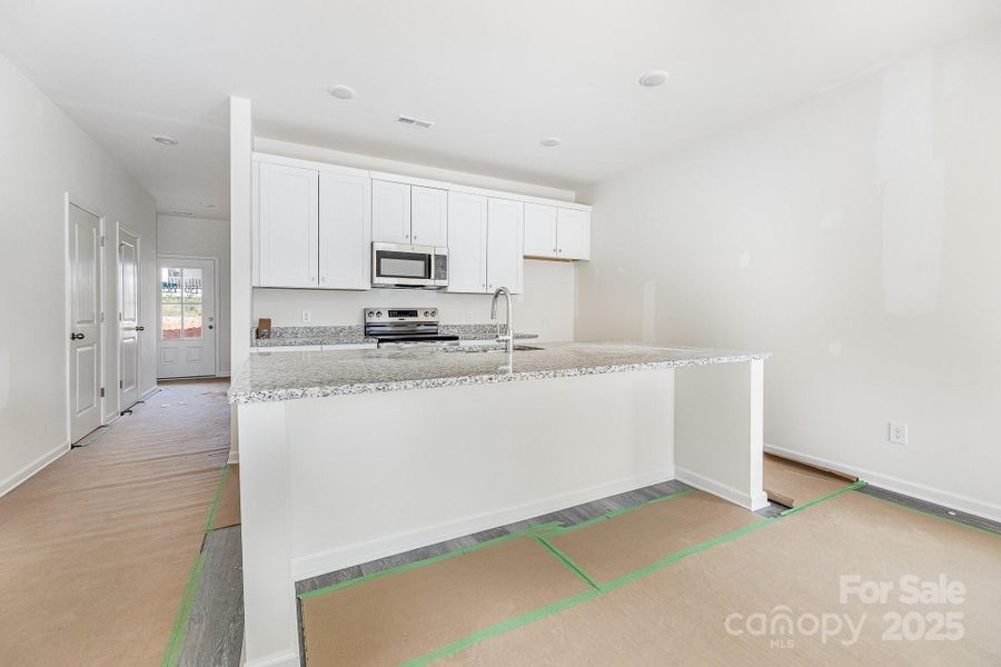Furnished interior view inside a new home in , Statesville (Image 6).