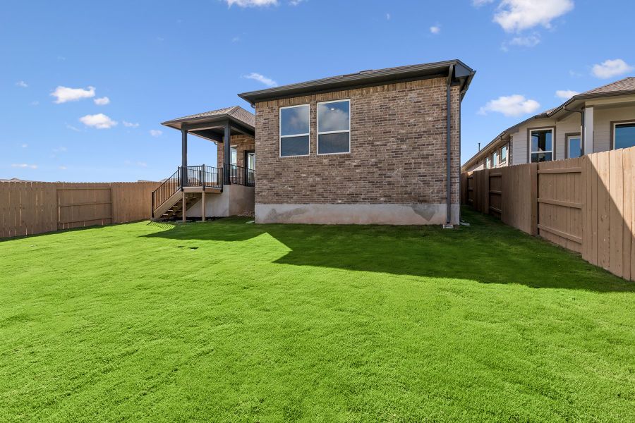 Exterior details and patio area of a home in The Colony, Bastrop (Image 4).