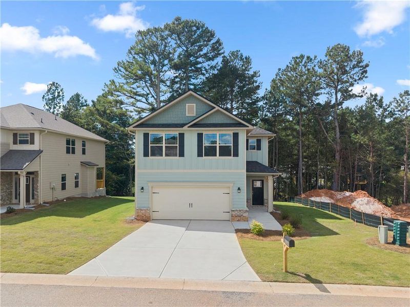 Front exterior of a new home in Magnolia Villas, Cornelia, GA, highlighting curb appeal (Image 2). Front exterior of a new home in Magnolia Villas, Cornelia, GA, highlighting curb appeal (Image 2).