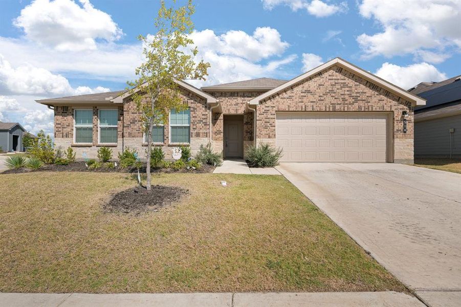 Front exterior of a new home in The Parks of Alvarado, Alvarado, TX, highlighting curb appeal (Image 23).