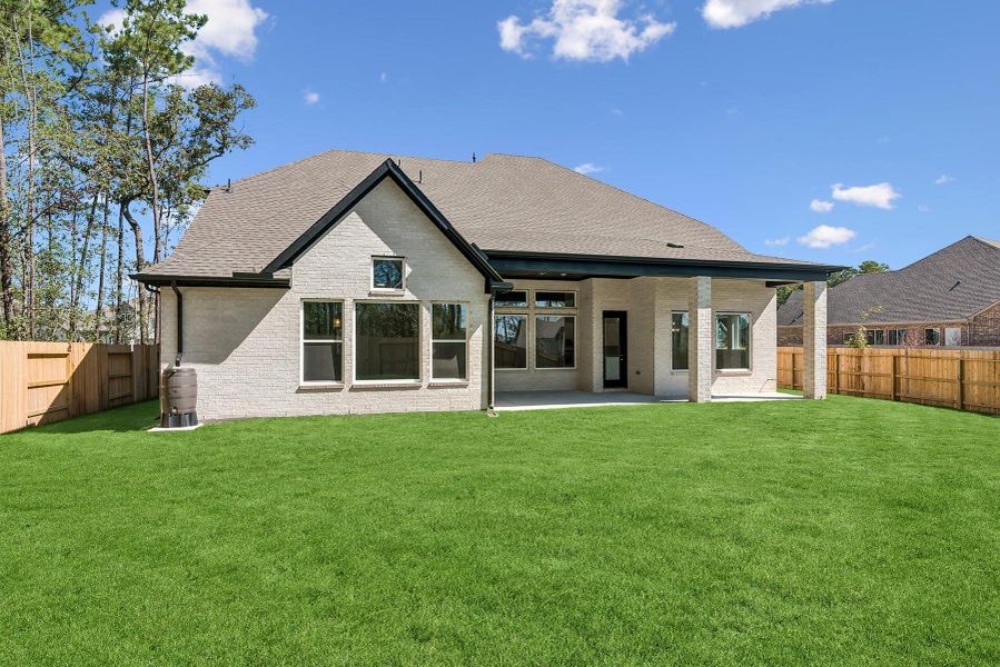 Exterior details and patio area of a home in ARTAVIA 65' Homesites, Conroe (Image 24).