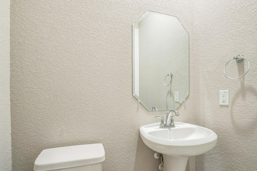 Bathroom featuring a sink and toilet Bathroom featuring a sink and toilet