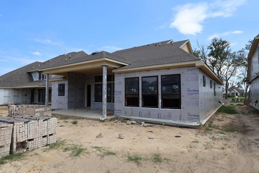 Front exterior of a new home in Riceland 60’ Homesites, Mont Belvieu, TX, highlighting curb appeal (Image 1). Front exterior of a new home in Riceland 60’ Homesites, Mont Belvieu, TX, highlighting curb appeal (Image 1).
