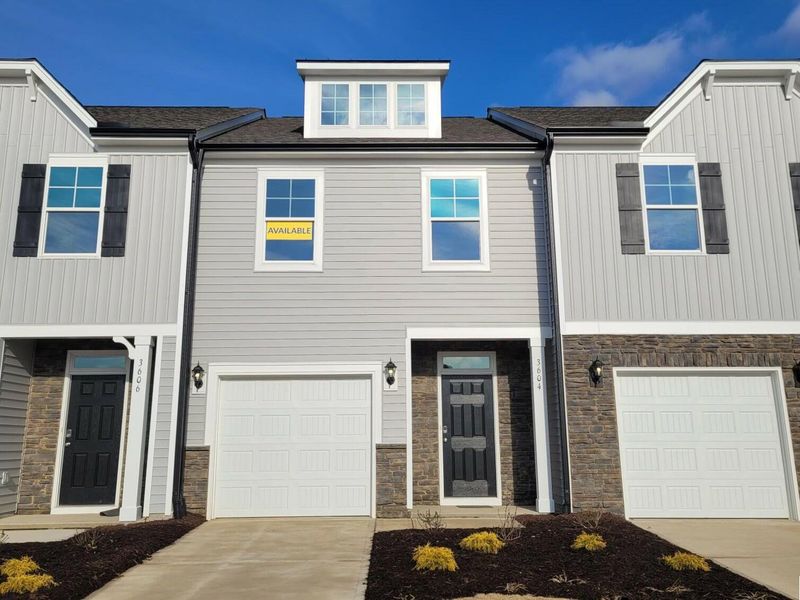 Front exterior of a new home in 1158 Place Townhomes, Wilson, NC, highlighting curb appeal (Image 1).