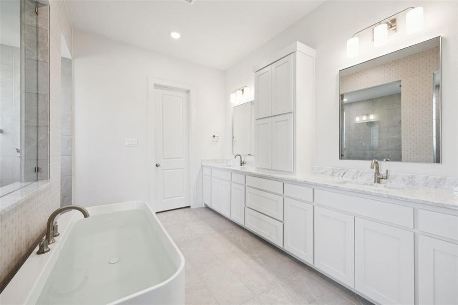 With his and her vanities, there is plenty of room for 2 in this lovely owner's bath. With his and her vanities, there is plenty of room for 2 in this lovely owner's bath.