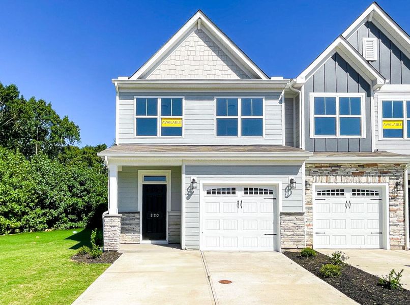 Front exterior of a new home in Riverbrooke Townhomes, Simpsonville, SC, highlighting curb appeal (Image 1). Front exterior of a new home in Riverbrooke Townhomes, Simpsonville, SC, highlighting curb appeal (Image 1).