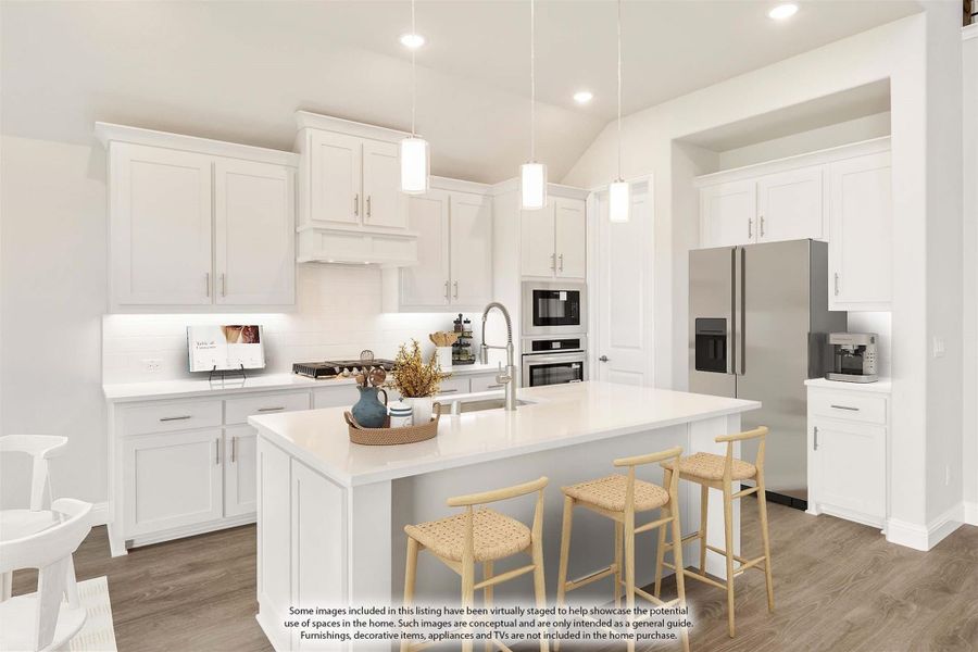 Kitchen with white cabinets, center island with seating, stainless steel appliances, and pendant lights over hardwood floors