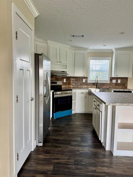 Furnished interior view inside a new home in , Okeechobee (Image 5).