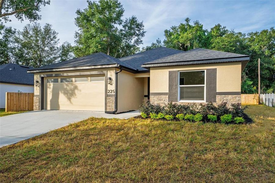 Front exterior of a new home in , Umatilla, FL, highlighting curb appeal (Image 35). Front exterior of a new home in , Umatilla, FL, highlighting curb appeal (Image 35).