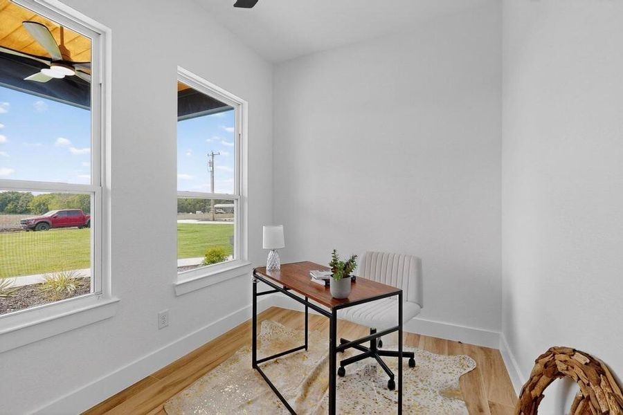 Office featuring light wood-type flooring and a ceiling fan