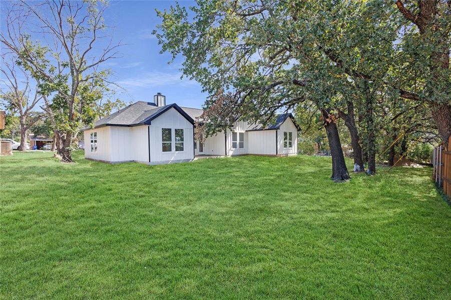 Back of house featuring a lawn