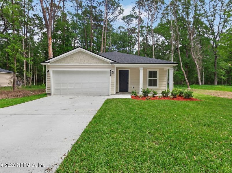 Front exterior of a new home in , Jacksonville, FL, highlighting curb appeal (Image 26).