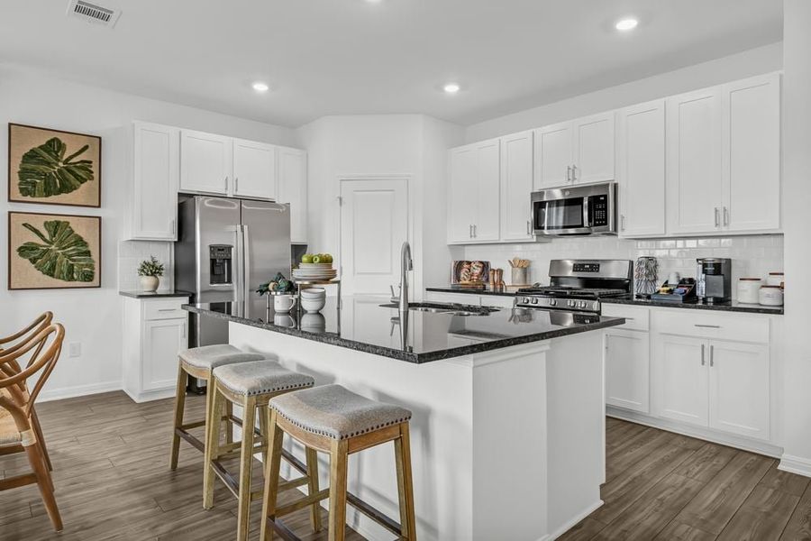Representative furnished interior of a home built from the Robin by Taylor Morrison in Longview 50s, Del Valle (Image 4).