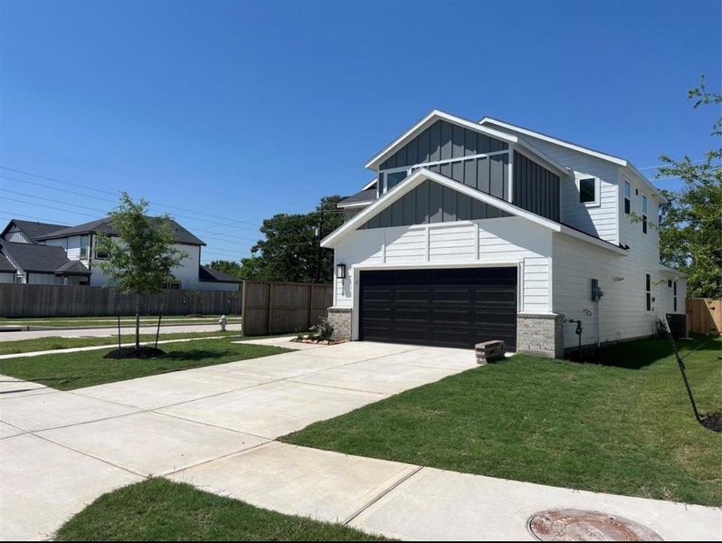 Front exterior of a new home in Arcadia 40s, Missouri City, TX, highlighting curb appeal (Image 18).