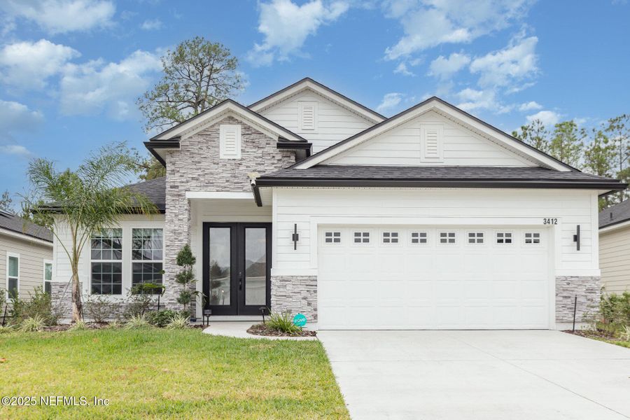 Front exterior of a new home in Hyland Trail, Green Cove Springs, FL, highlighting curb appeal (Image 2). Front exterior of a new home in Hyland Trail, Green Cove Springs, FL, highlighting curb appeal (Image 2).
