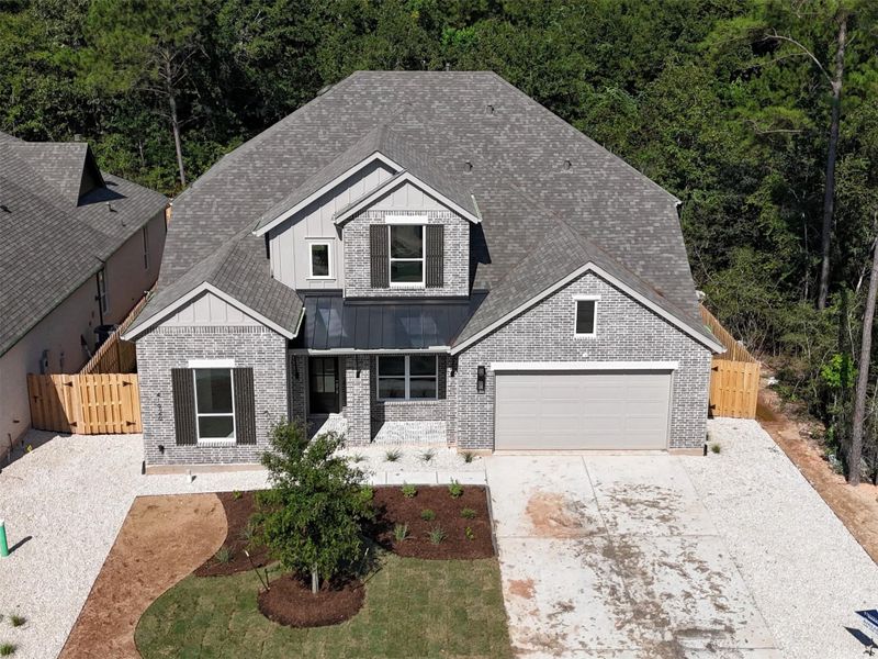 Front exterior of a new home in COLTON: 60ft. lots, Magnolia, TX, highlighting curb appeal (Image 2). Front exterior of a new home in COLTON: 60ft. lots, Magnolia, TX, highlighting curb appeal (Image 2).