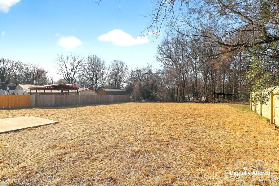 Yard has seed and straw.