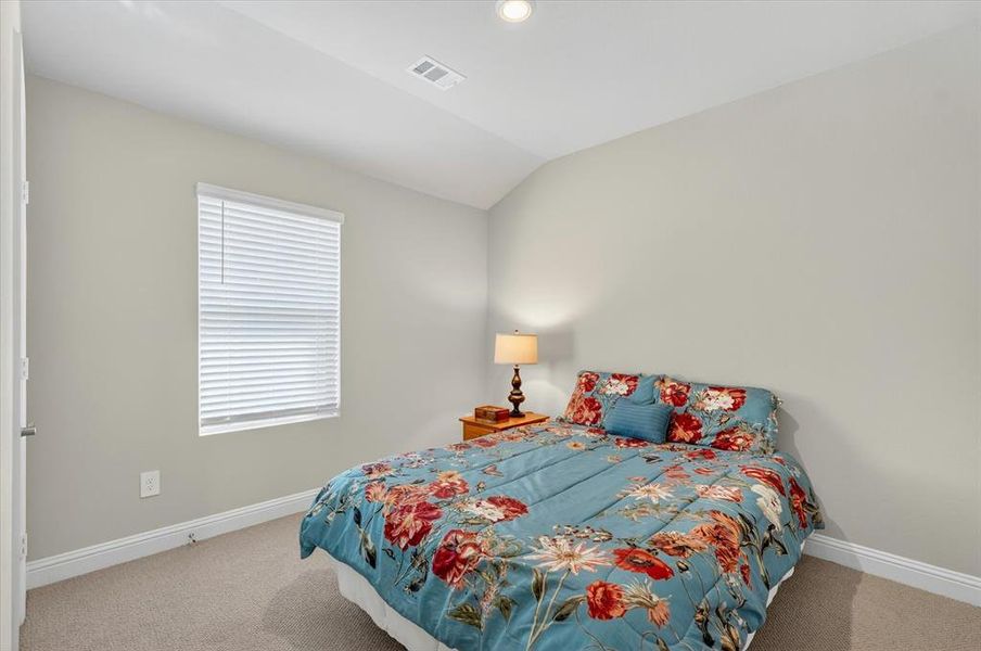 Carpeted room with light neutral walls, white trim, and a single window featuring horizontal blinds Carpeted room with light neutral walls, white trim, and a single window featuring horizontal blinds