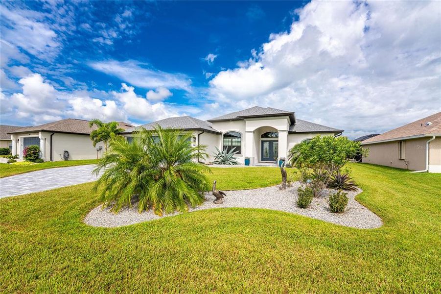 Front exterior of a new home in , Rotonda West, FL, highlighting curb appeal (Image 23).