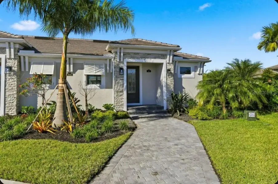 Front exterior of a new home in , Bradenton, FL, highlighting curb appeal (Image 1). Front exterior of a new home in , Bradenton, FL, highlighting curb appeal (Image 1).