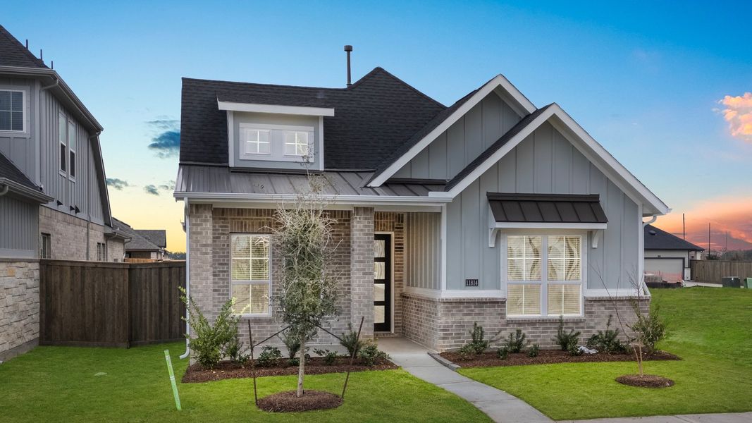 Front exterior of a new home in Riceland, Mont Belvieu, TX, highlighting curb appeal (Image 15).