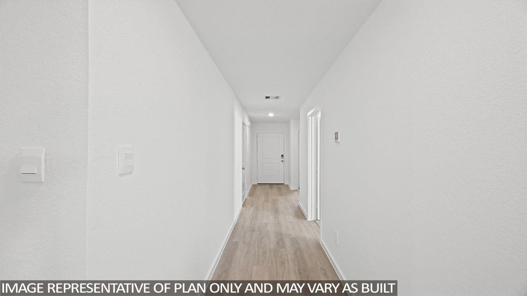 Hall with baseboards and light wood-style flooring
