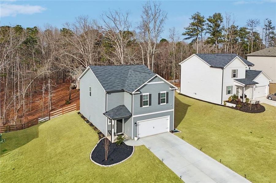 Front exterior of a new home in Ashley Falls, Douglasville, GA, highlighting curb appeal (Image 10).